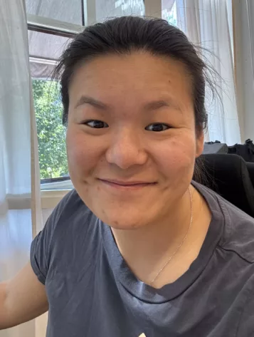 Porträttfoto av Kim Wang